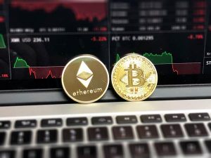 Gold coins with bitcoin symbol and ethereum symbol.
