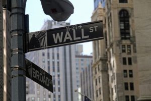 Wall street and Broadway street signs
