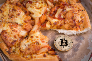 pizza and gold coin with bitcoin symbol