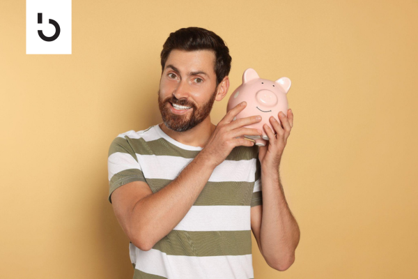 man holding a piggy bank