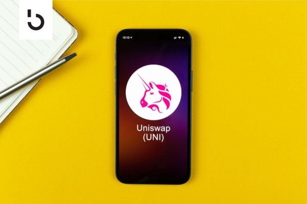 uniswap logo on a mobile phone