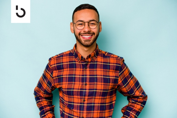 smiling man with plaid shirt